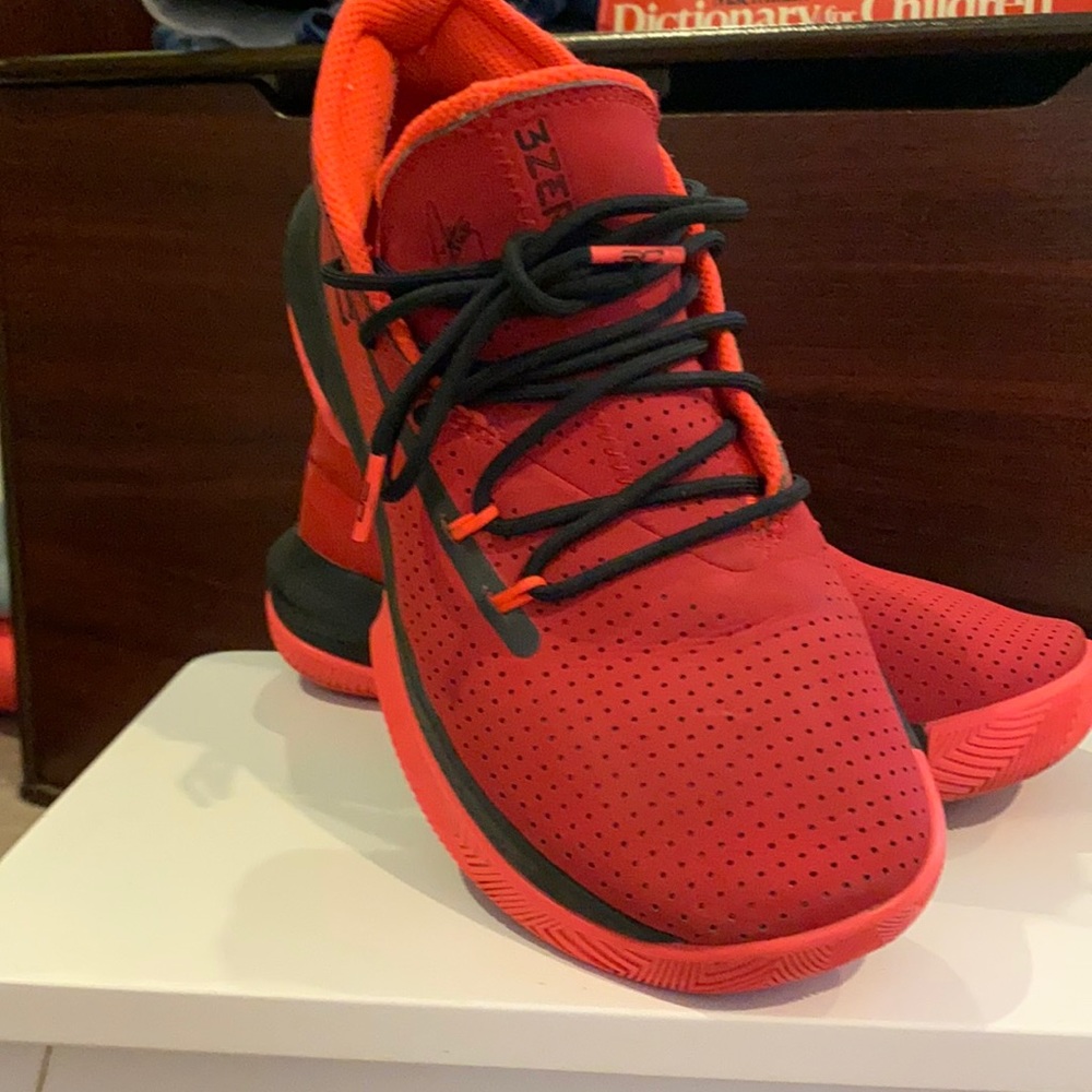 Red Steph curry under armour sneakers